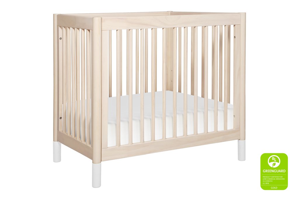 white and natural wood crib